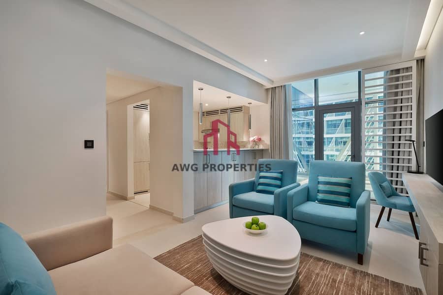 15 NH_Collection_Dubai_The_Palm_Superior_One_Bedroom_Apartment_Living_Area. jpg