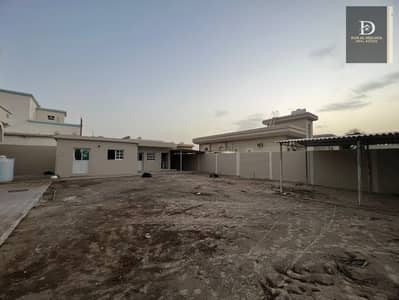 For sale in Sharjah, Al-Ramaqiya area, a very clean house, area 10,350 feet, consisting of three rooms, a hall, a large sitting room, and an external annex consisting of a maids room, a kitchen, a storeroom, a laundry, and a large courtyard. One million