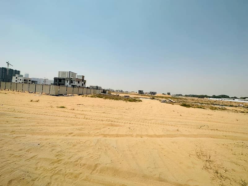 BIGGEST PLOT IN HLIEW 2 ON MAIN ROAD AJMAN FREE HOLD LAND