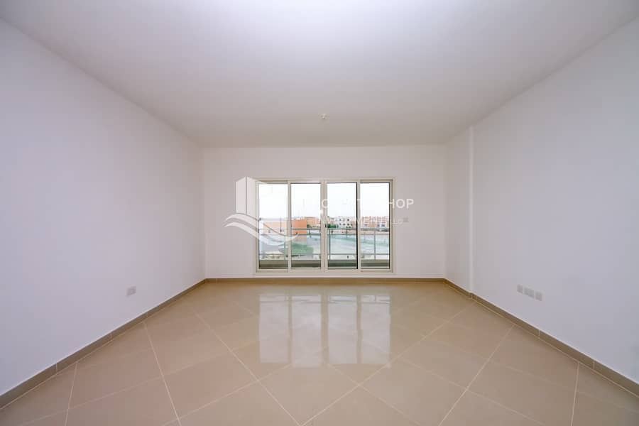 7 2-bedroom-apartment-abu-dhabi-al-reef-downtown-living-area. JPG