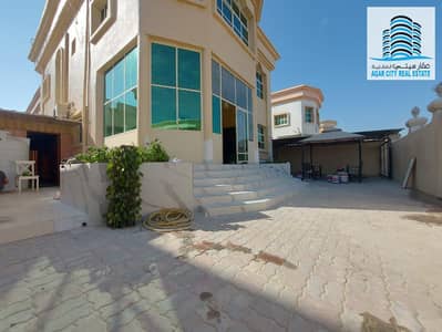 A villa for rent on Jar Street, consisting of a hall and a sitting room, 5 bedrooms, in Al Rawda 3, Ajman