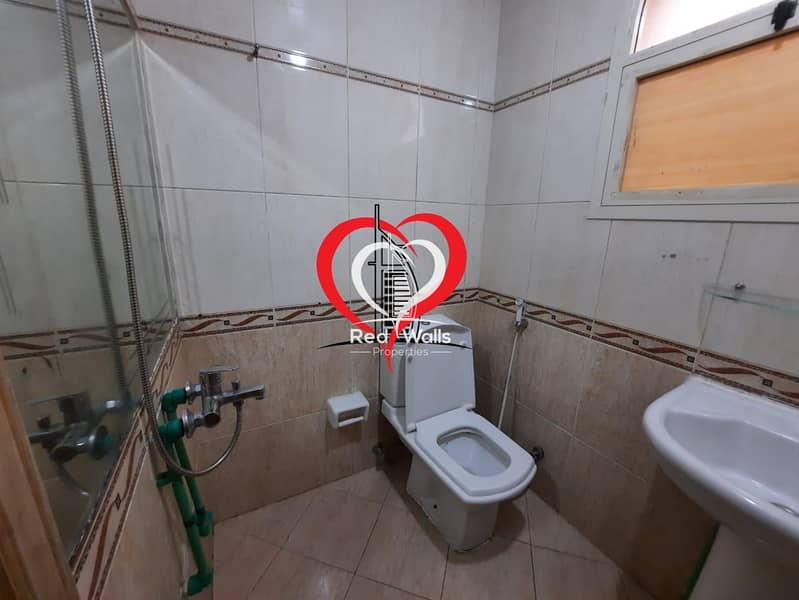 9 A BIG PARTITIONED STUDIO WITH SEPARATE KITCHEN AND BATHROOM LOCATED AT AL NAHYAN.