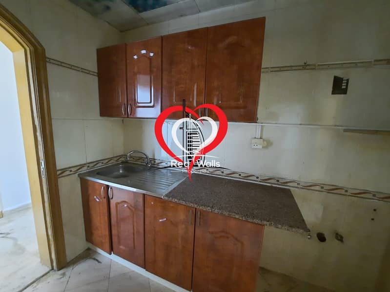 10 A BIG PARTITIONED STUDIO WITH SEPARATE KITCHEN AND BATHROOM LOCATED AT AL NAHYAN.