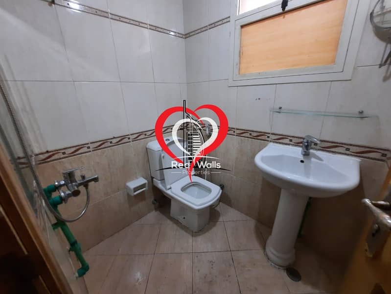 12 A BIG PARTITIONED STUDIO WITH SEPARATE KITCHEN AND BATHROOM LOCATED AT AL NAHYAN.