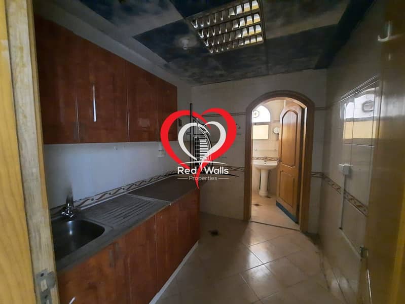 14 A BIG PARTITIONED STUDIO WITH SEPARATE KITCHEN AND BATHROOM LOCATED AT AL NAHYAN.