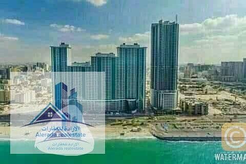 For sale apartments in comfortable installments In Ajman at the price of your rent,,, Direct sea view