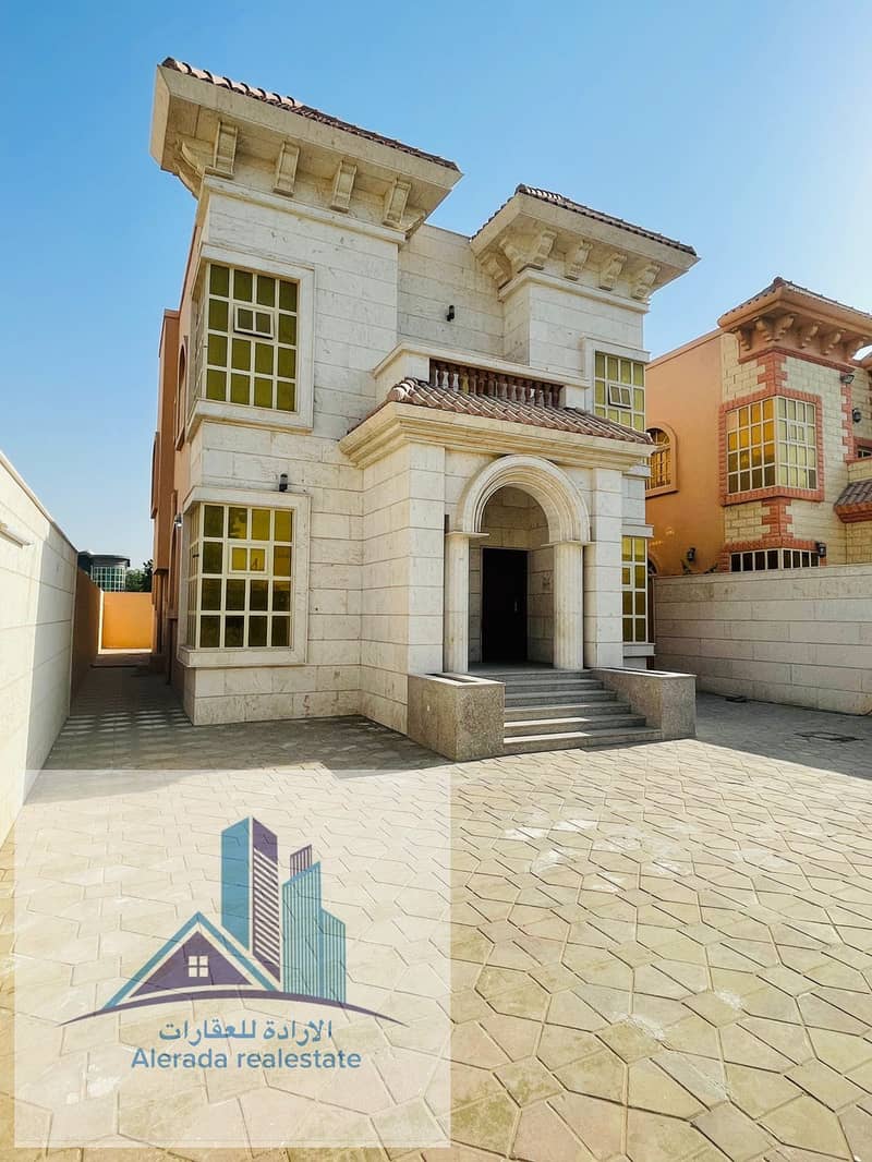 Villa for sale in Ajman, Al Rawda area, with water and electricity, a stone front, personal finishing