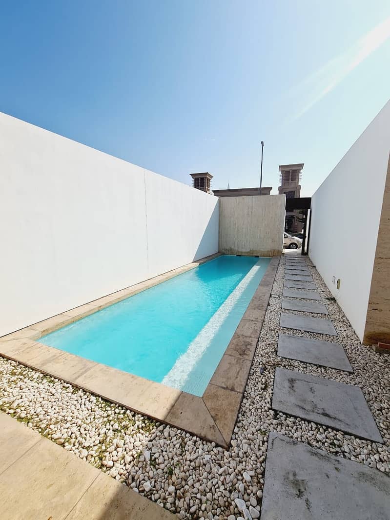 13 Modern independent 3bhk villa with privet pool with garden in Jumeirah 1 rent is 400k