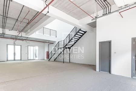 Warehouse for Rent in Dubai Production City (IMPZ), Dubai - Road facing Warehouse with a Showroom