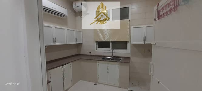 3 Bedroom Flat for Rent in Al Bahia, Abu Dhabi - For rent in Al Bahia, behind Deerfields Mall, an apartment on the first floor, two rooms, a hall, a maid’s room, and a kitchen