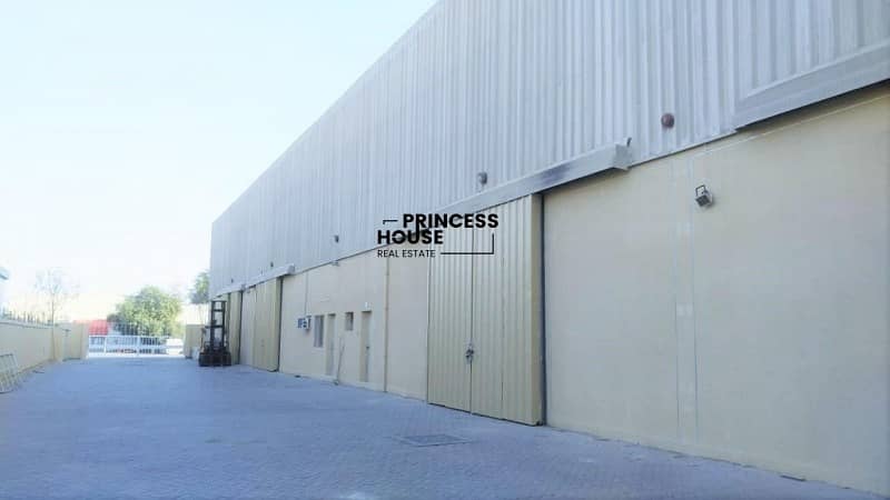 A WELL INSULATED HUGE STORAGE WAREHOUSE IN A CLEAN COMPOUND ON MAIN ROAD