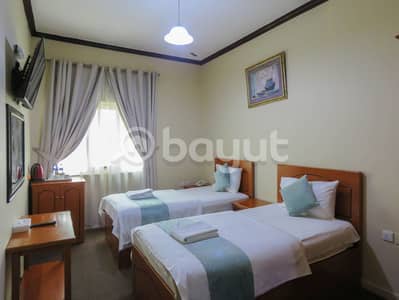 Hotel Apartment for Rent in Al Shuwaihean, Sharjah - Studio Twin Daily rental