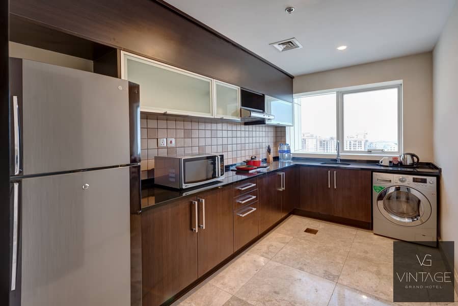 2 Ghaya Grand Hotel Dubai - Two Bedroom closed kitchen. jpg