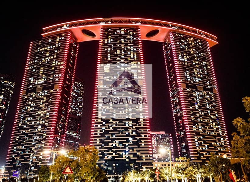 Abu-Dhabi’s-iconic-Gate-Towers-in-Al-Reem-Island-light-up-in-red-to-celebrate-the-entry-of-the-Hope-Probe-to-the-Mars-orbit-2. jpg