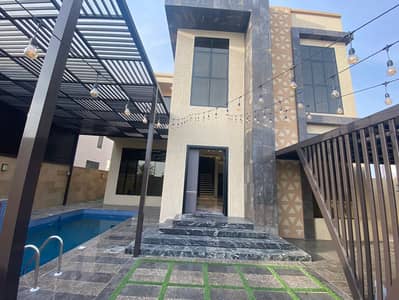 Villa for rent in Ajman, Al Aliyah area With an annex and a covered swimming pool with furniture