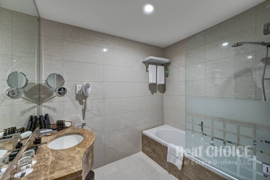 7 Ghaya Grand Hotel Dubai - Two Bedroom Bathroom 3. jpg