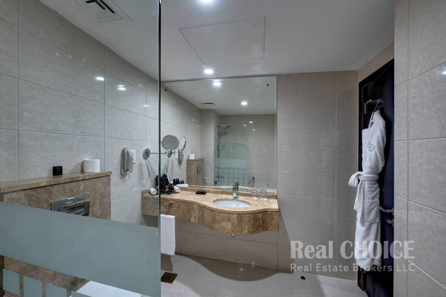 9 Ghaya Grand Hotel Dubai - Two Bedroom Bathroom 4. jpg