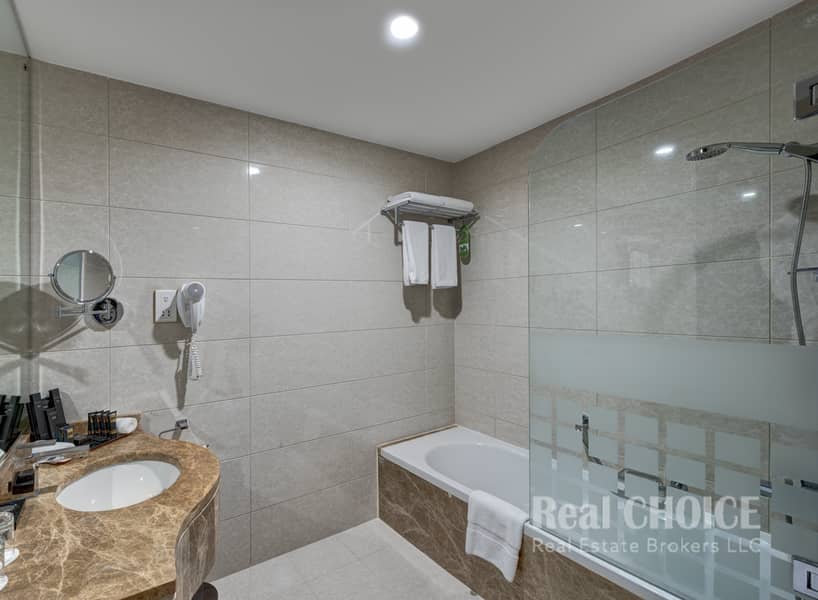 4 Ghaya Grand Hotel Dubai- Studio Bathroom 3. jpg