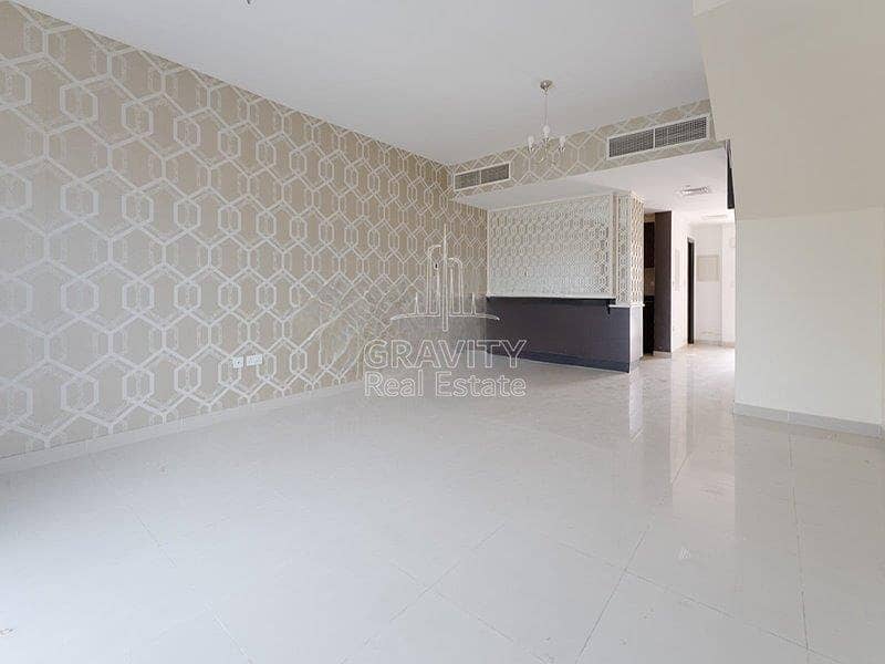 2 spacious-living-area-w-nice-wallpapers-of-a-3-bedroom-villa-in-al-reef-village-mediterranean-style-for-sale. jpg