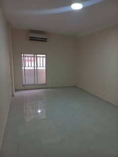 A room and a hall for annual rent in Al Khatim Building - Al Mowaihat at a price of 22 thousand annually