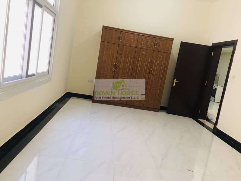 8 Huge 1- bedroom hall with private entrance in khalifa city A .  (SHARED SWIMMING POOL)