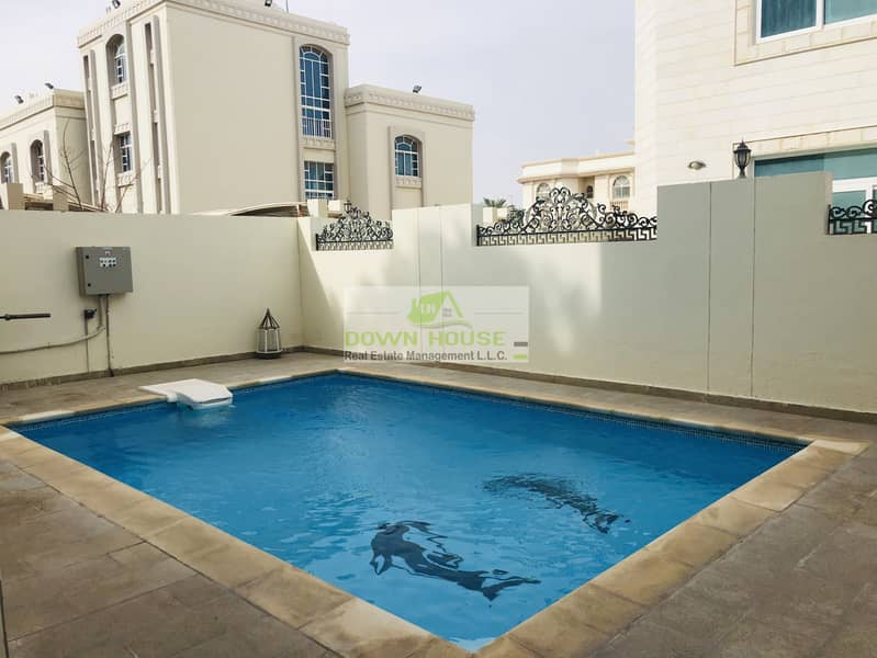 11 Neat huge Studio flat in Khalifa city A . Shared swimming pool .
