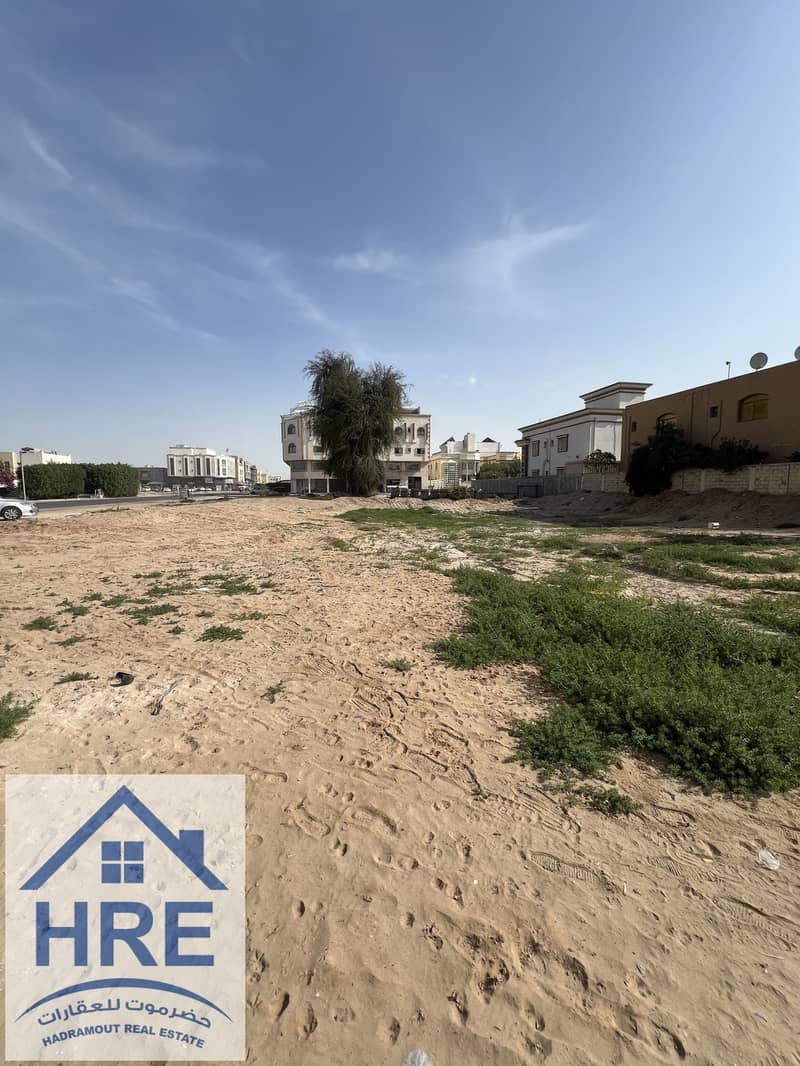 Residential and commercial corner land for sale in Al Mowaihat 3, near Academy Street, ADNOC Petrol Station, and Sheikh Ammar Street.
