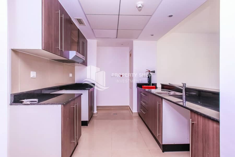 8 1-bedroom-apartment-abu-dhabi-al-reef-downtown-kitchen. JPG