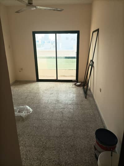 One room and a hall for 19,000, 2 bathrooms, with balcony, open view, air conditioning, split plan,  Al Bustan, close to Al Mina Street,  payment in 6