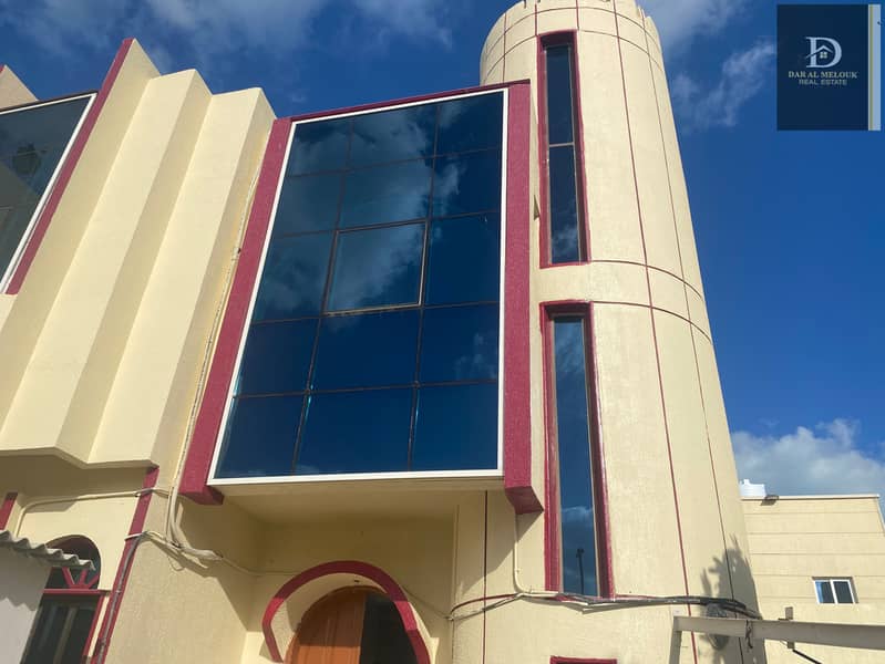For rent in Sharjah, Sharqan area, a villa directly on the main street