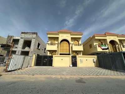 Two-storey villa for rent in Ajman, Al Yasmeen area 5 bedrooms, a living room and a living room And a maid's room With air conditioners 100 thousand dirhams required