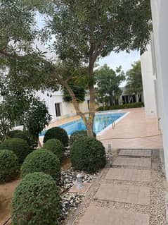 Very spacious 4 br villa with maids room & common pool @ Garhoud.
