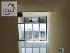 For rent in Ajman in Mushrif, two rooms and a hall with a sea view, with free parking and free maintenance