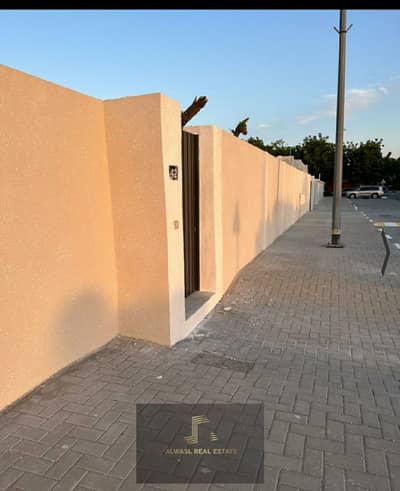 For sale villa in Sharjah, Al Khuzamia area, a special location, the second piece of the main street