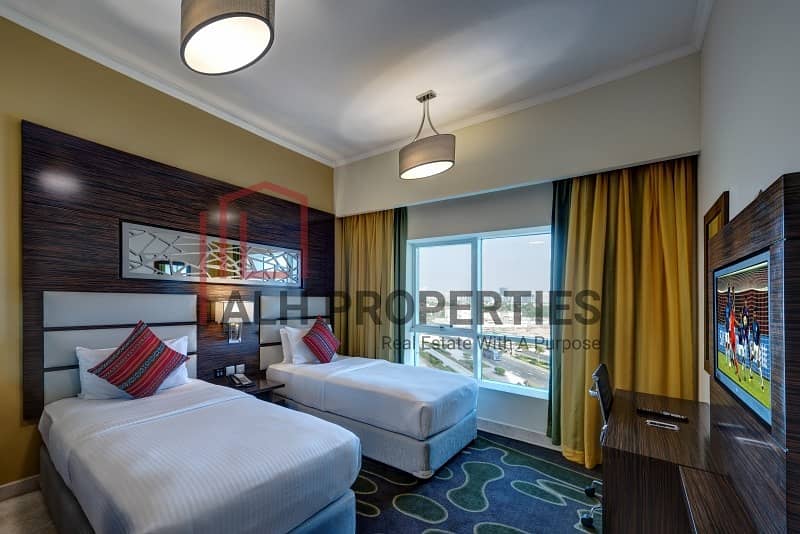شقة فندقية في فندق فينتاج جراند،مدينة دبي للإنتاج 2 غرف 144000 درهم - 8593730