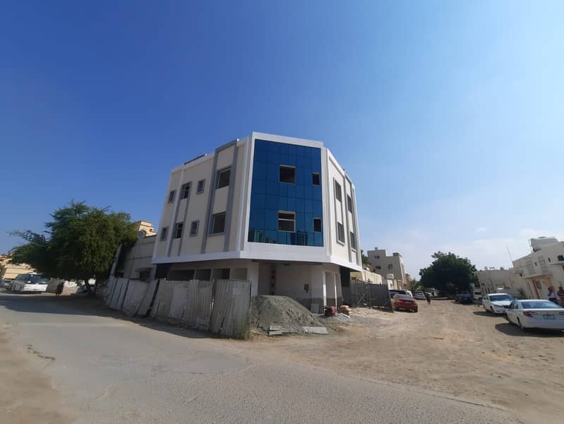 For sale in Ajman, Al Rashidiya area, a new building, the first inhabitant, super luxurious finishing, corner of two residential and commercial streets, consisting of 3 studios, 2 rooms and a hall, 2 rooms and a hall, and 3 shops. 

 The building is super