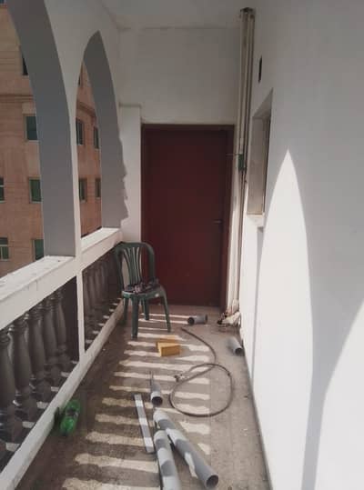 For annual rent in Ajman, two rooms, a hall, a kitchen, and two bathrooms in Al Rashidiya 3, next to Amina Hospital, close to all public and private s