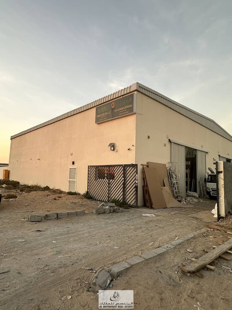 For sale, a built-up land in Al Saja’a, Sharjah, with 2 rented warehouses and an income of 95 thousand