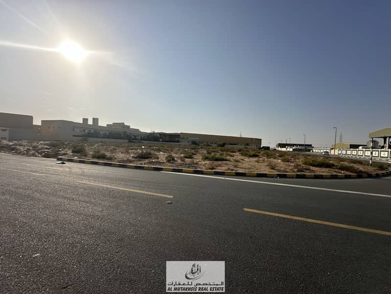 For sale, industrial land in Emirates Industrial City, Sharjah, area of ​​65 thousand feet, corner location on two streets, free ownership for all nationalities.