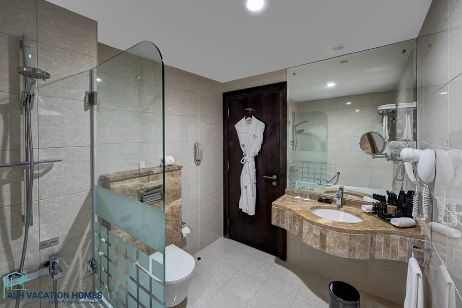 5 Ghaya Grand Hotel Dubai - Studio Bathroom 2. jpg