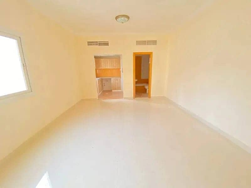 BIG OFFER // LIKE NEW BUILDING// STUDIO APARTMENT WITH SEPRATE KITCHEN WITH BALCONY ONLY 18500 IN AL QASIMIA
