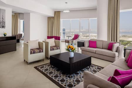 4 Bedroom Hotel Apartment for Rent in Al Barsha, Dubai - Four Bedroom Apartment - Living Room. jpg