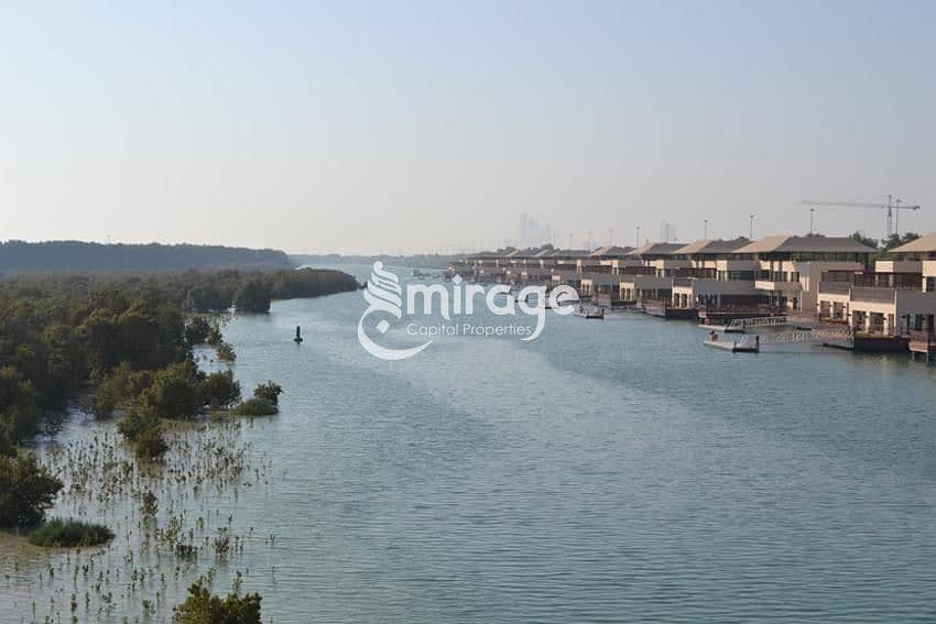 9 Actual-JBCdTw8TPat1D8iCmwsX1019the_view_of_the_five_bedroom_waterfront_villas_from_the_access_bridge_within_al_gurm. jpg