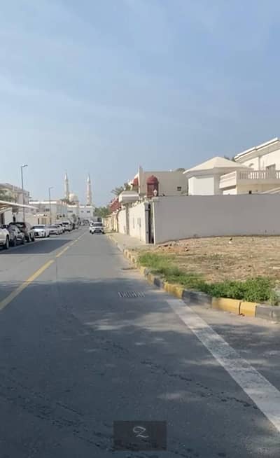 For sale a corner plot of land in Sharjah / Sharqan area, Al-Hira suburb special location, the second piece of the main street, Kuwait Hospital Street