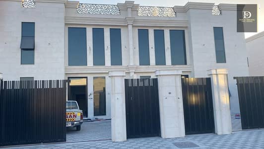 5 Bedroom Villa for Rent in Hoshi, Sharjah - For rent in Sharjah, Al-Hoshi area, a residential investment villa with an area of ​​5,000 square feet, consisting of two floors, ground and first. The ground floor consists of a room, a hall, a bathroom, and a kitchen. The second floor consists of 3 mast