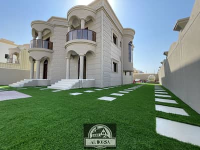 5 Bedroom Villa for Sale in Al Rawda, Ajman - Villa for sale on the corner of two asphalt streets, with electricity, water and air conditioners, freehold for all nationalities, at a very attractiv
