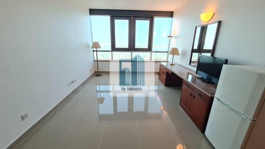 Studio for Rent in Corniche Road, Abu Dhabi - Studio Apartment Available With Water Electricity Included