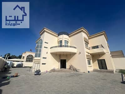 Villa for rent in Al Hamidiya area, central air conditioning, large area with an indoor awning