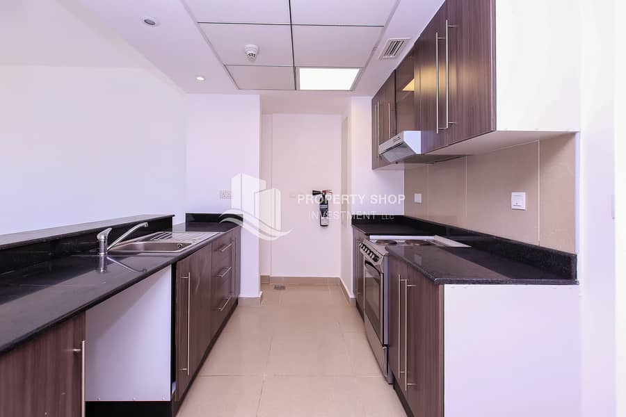 7 2-bedroom-apartment-abu-dhabi-al-reef-downtown-kitchen. JPG