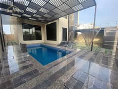A distinctive villa for rent in Ajman Al Ali, with a swimming pool and furnishings